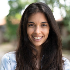 girl with brown hair smiling